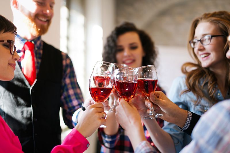 Group of successful architects celebrating in office